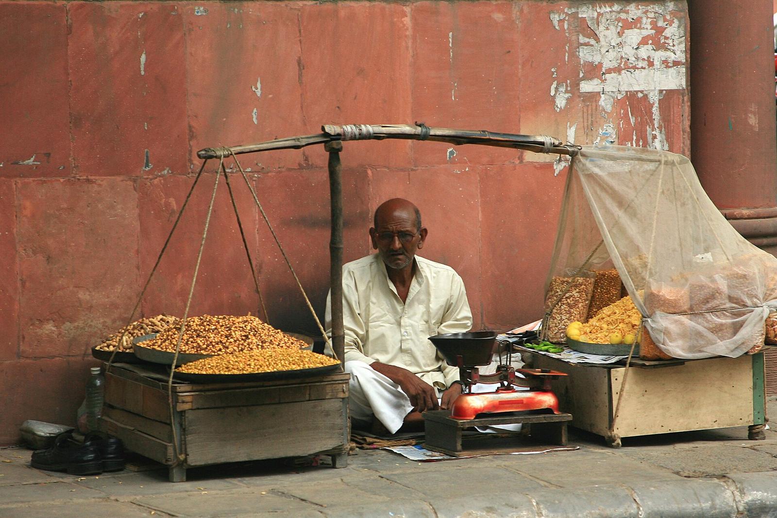 Merchant selling namkeen snacks, Khan Market, Delhi